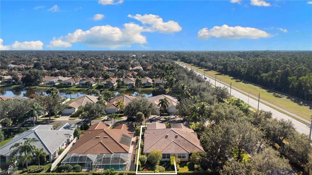 4907 Kingston Way Naples, FL 34119 - Photo 3 of 49 an aerial view of house with yard and mountain view in back