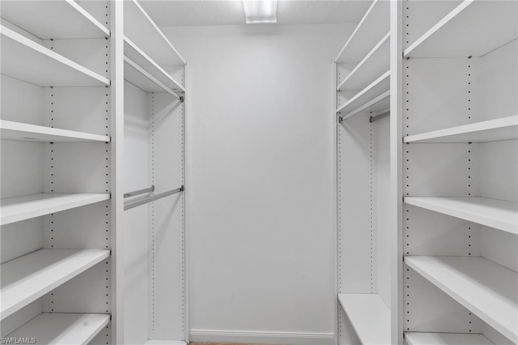 4907 Kingston Way Naples, FL 34119 - Photo 33 of 49 a view of an empty walk in closet