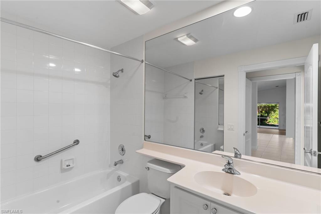 4907 Kingston Way Naples, FL 34119 - Photo 34 of 49 a bathroom with a sink toilet and shower