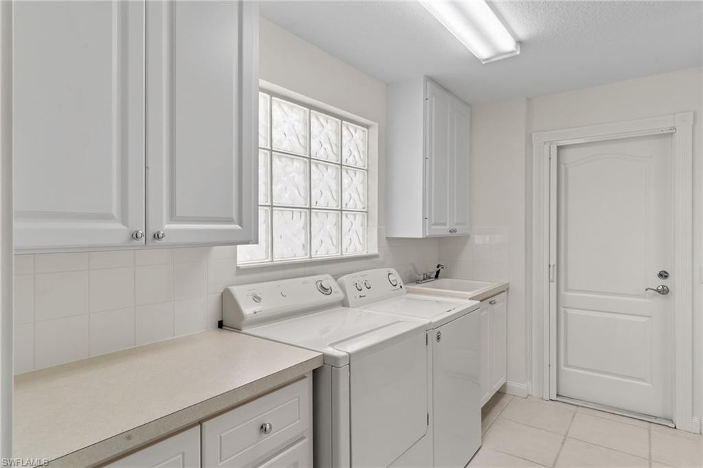 4907 Kingston Way Naples, FL 34119 - Photo 37 of 49 a utility room with a sink and a window