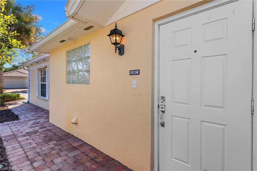 4907 Kingston Way Naples, FL 34119 - Photo 39 of 49 a view of a door in the house