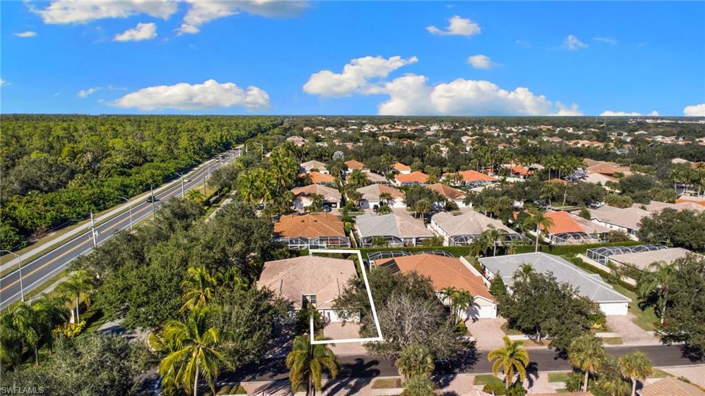 4907 Kingston Way Naples, FL 34119 - Photo 44 of 49 an aerial view of residential houses with outdoor space and street view