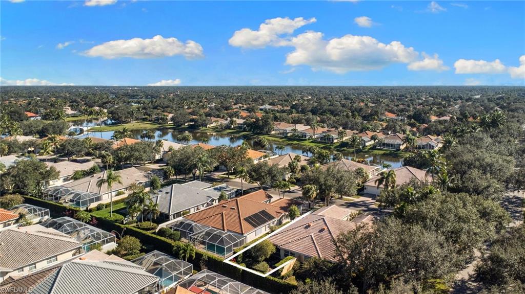4907 Kingston Way Naples, FL 34119 - Photo 45 of 49 an aerial view of residential houses with outdoor space
