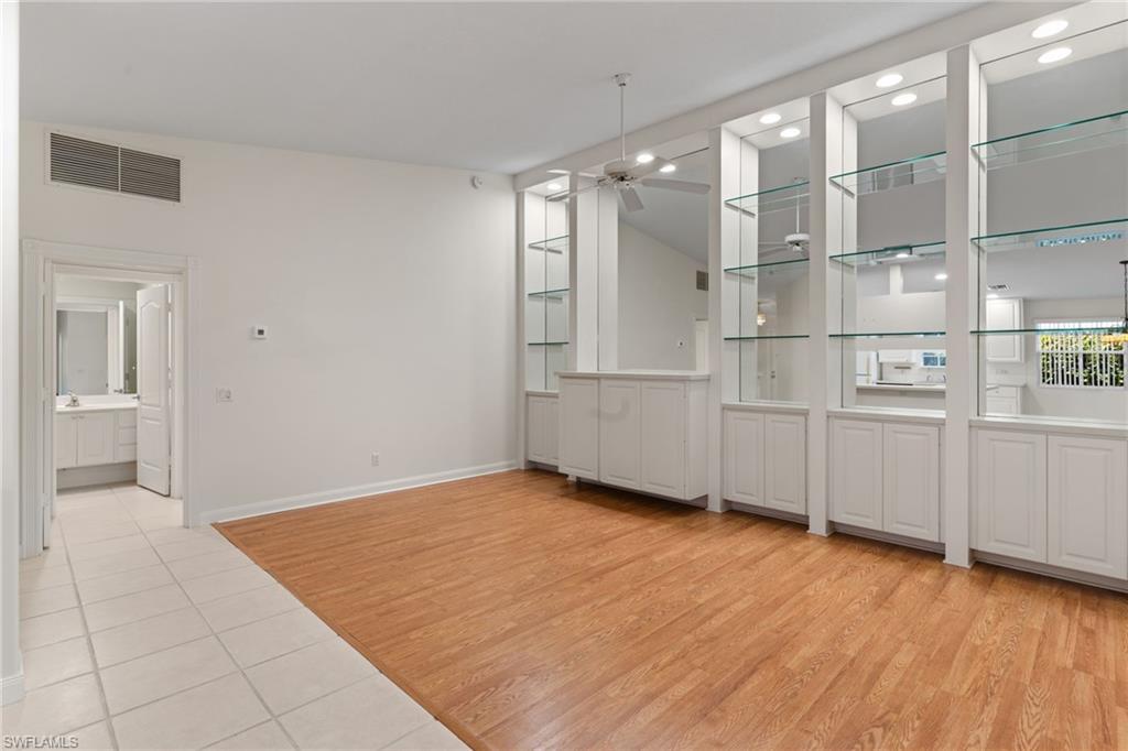 4907 Kingston Way Naples, FL 34119 - Photo 9 of 49 a view of empty room with wooden floor