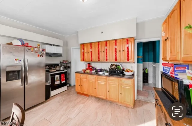 a kitchen with stainless steel appliances a stove and a refrigerator
