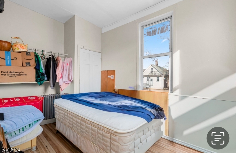 509 Marshall Street, Unit 2 Elizabeth Port, NJ 07206 - Photo 19 of 21 a bedroom with a bed and a window