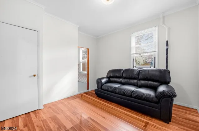 a living room with a couch and a window