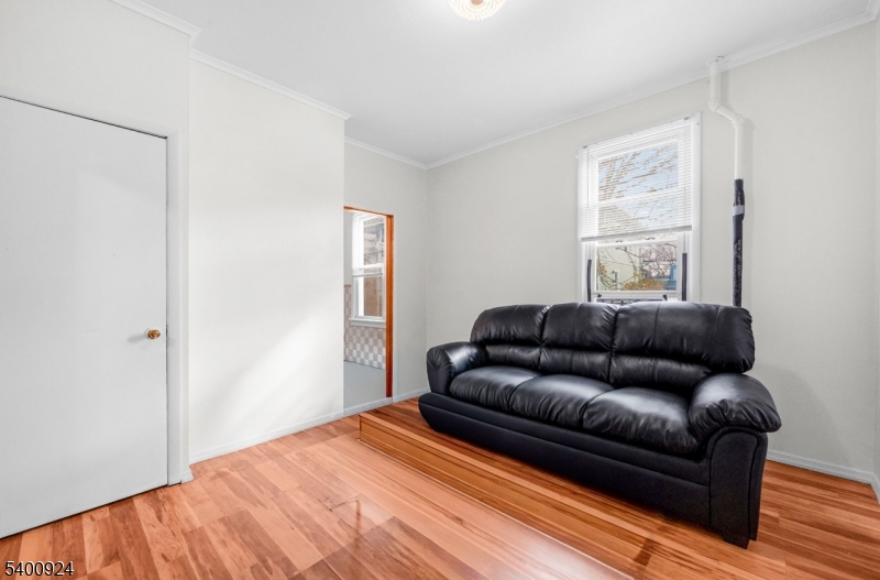 509 Marshall Street, Unit 2 Elizabeth Port, NJ 07206 - Photo 3 of 21 a living room with a couch and a window