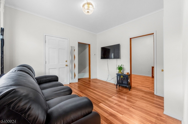 509 Marshall Street, Unit 2 Elizabeth Port, NJ 07206 - Photo 4 of 21 a living room with furniture and a wooden floor