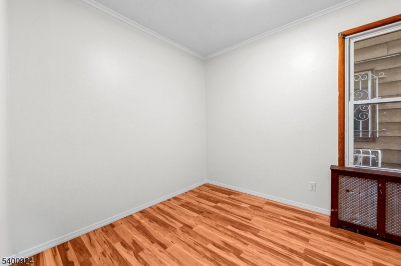 509 Marshall Street, Unit 2 Elizabeth Port, NJ 07206 - Photo 5 of 21 a view of a room with wooden floor and cabinet