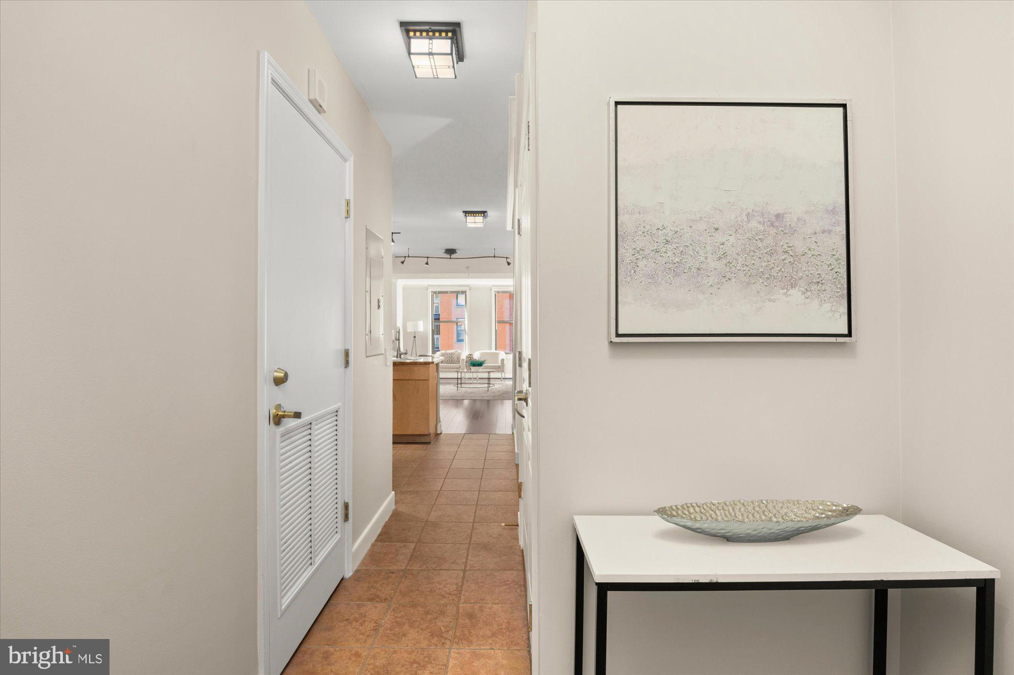 616 E Street Northwest, Unit 854 Washington, DC 20004 - Photo 3 of 87 Well-Proportioned Entryway Area with Guest Bath