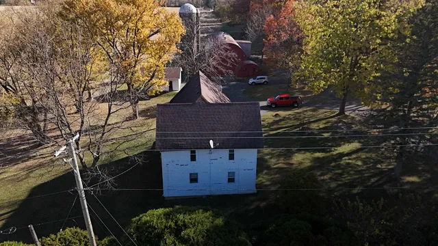 an aerial view of residential house with outdoor space
