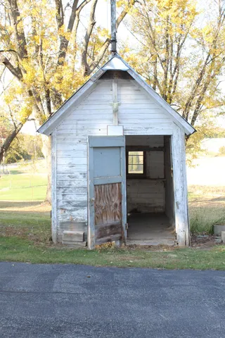 a backyard of a house with seating space