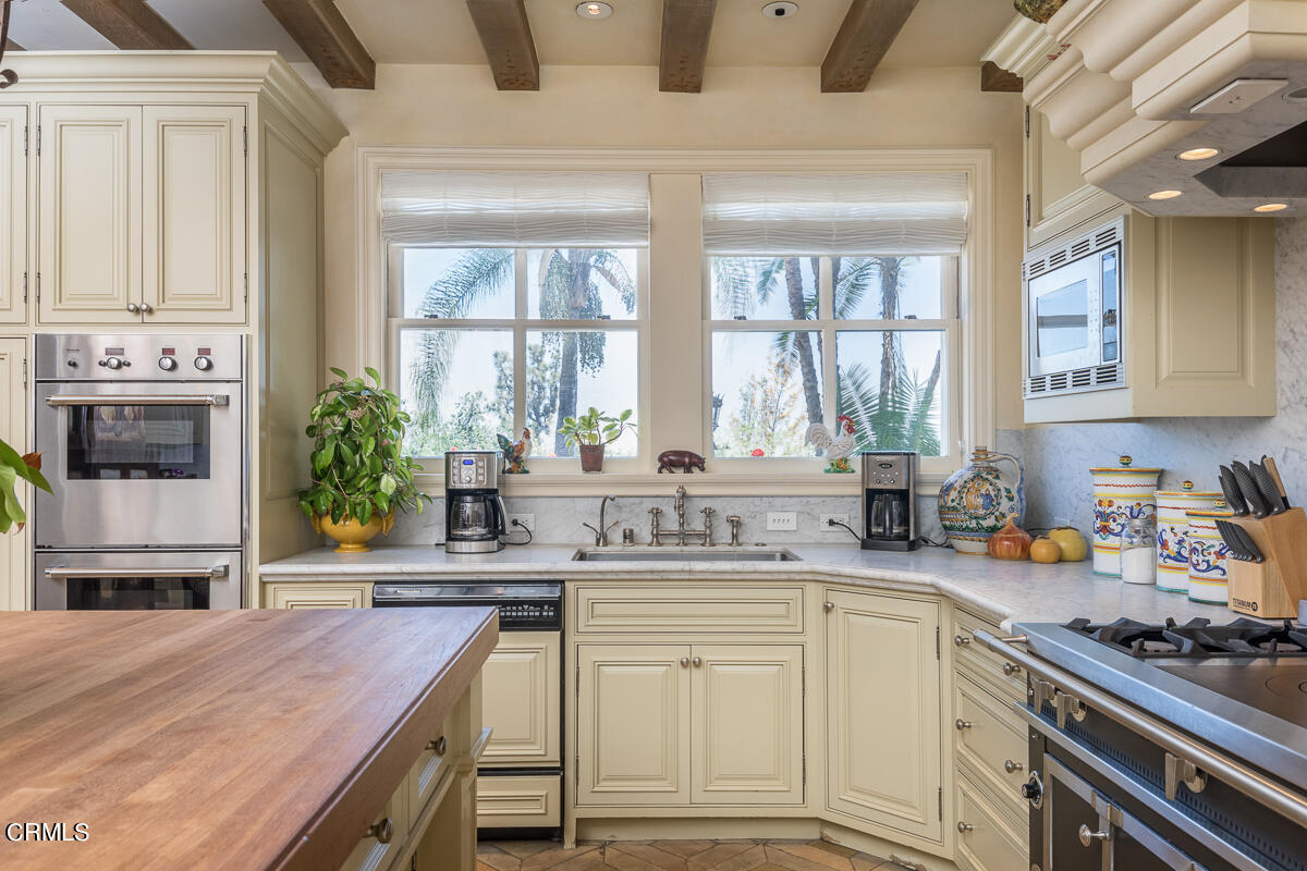 100 Los Altos Drive Pasadena, CA 91105 - Photo 19 of 72 a kitchen with a stove a sink and a cabinets