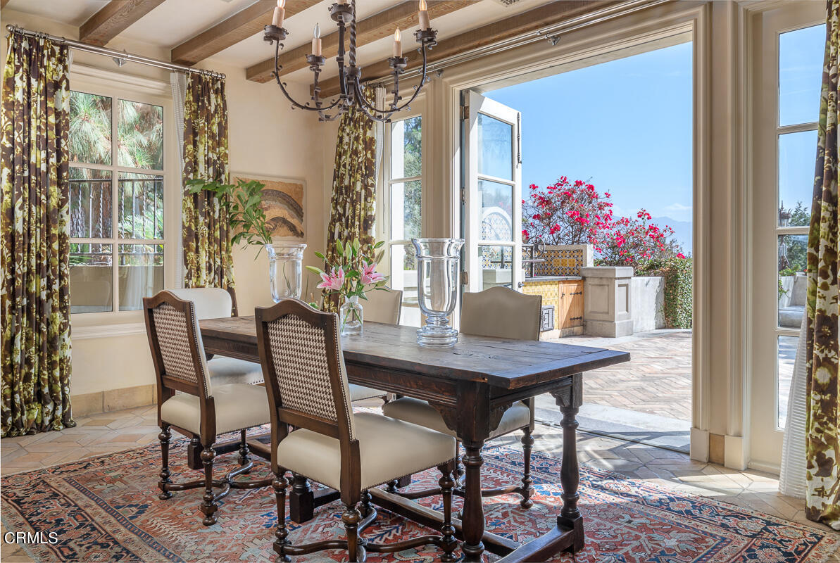 100 Los Altos Drive Pasadena, CA 91105 - Photo 20 of 72 a view of a dining room with furniture and a chandelier