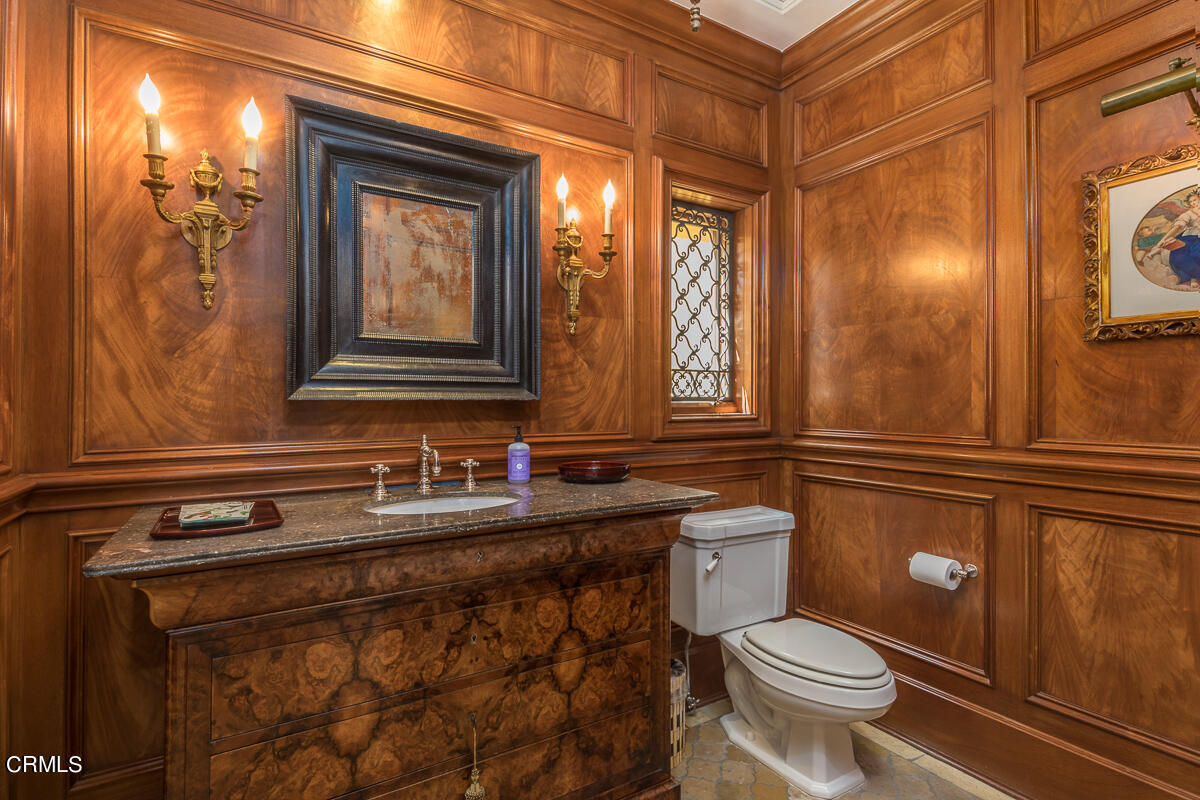 100 Los Altos Drive Pasadena, CA 91105 - Photo 24 of 72 a bathroom with a sink a toilet and mirror