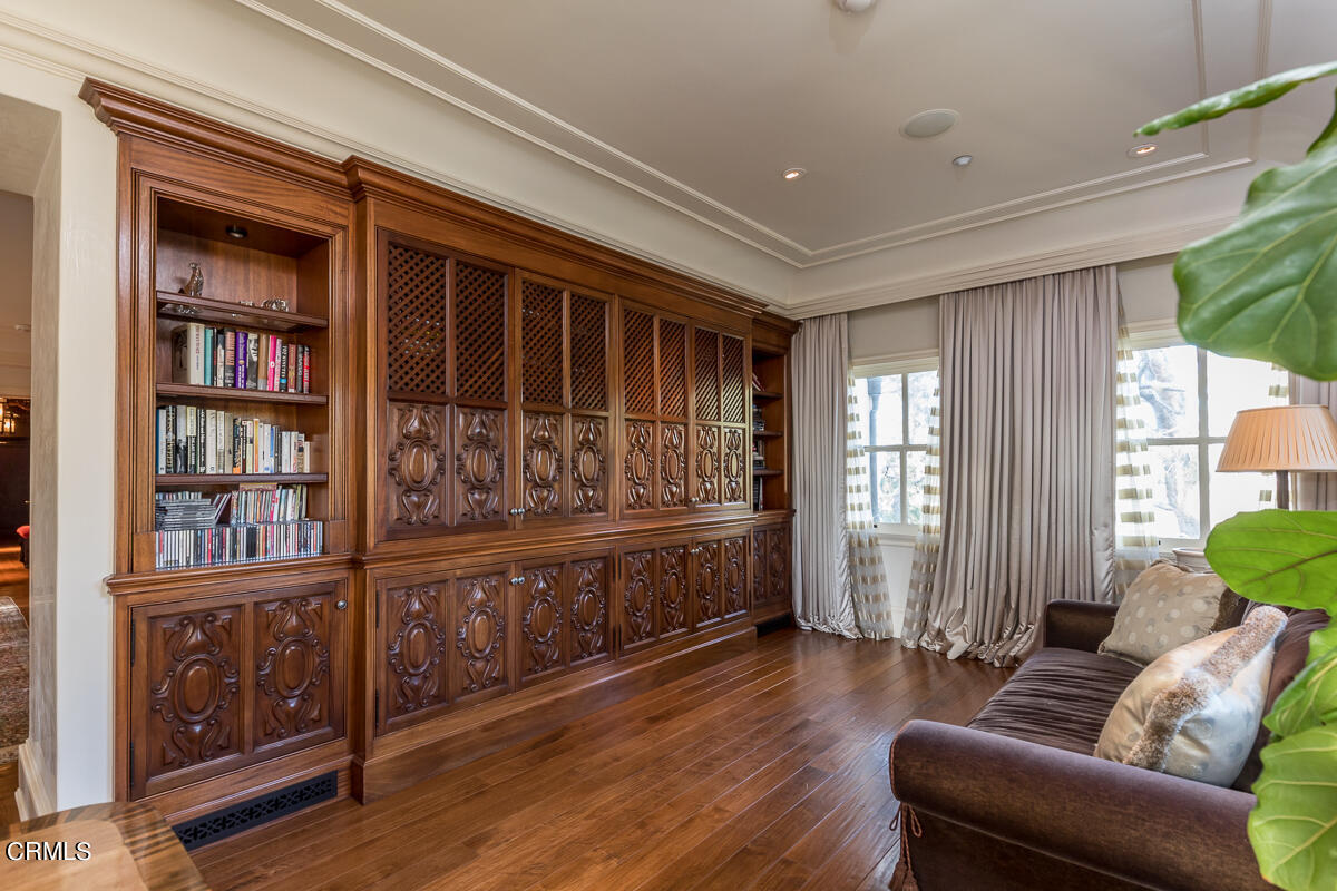 100 Los Altos Drive Pasadena, CA 91105 - Photo 36 of 72 a living room with furniture and a book shelf