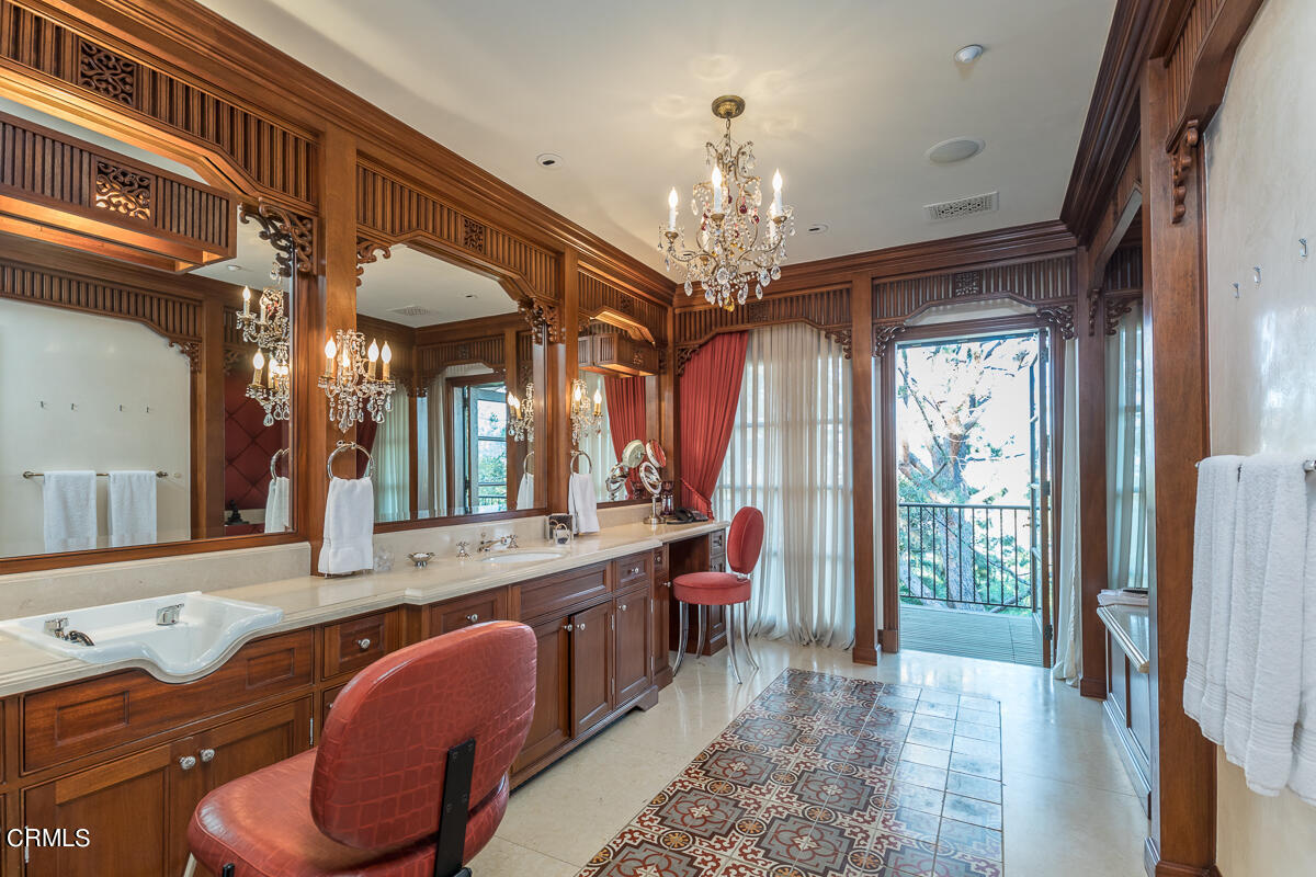 100 Los Altos Drive Pasadena, CA 91105 - Photo 38 of 72 a living room with furniture and a chandelier