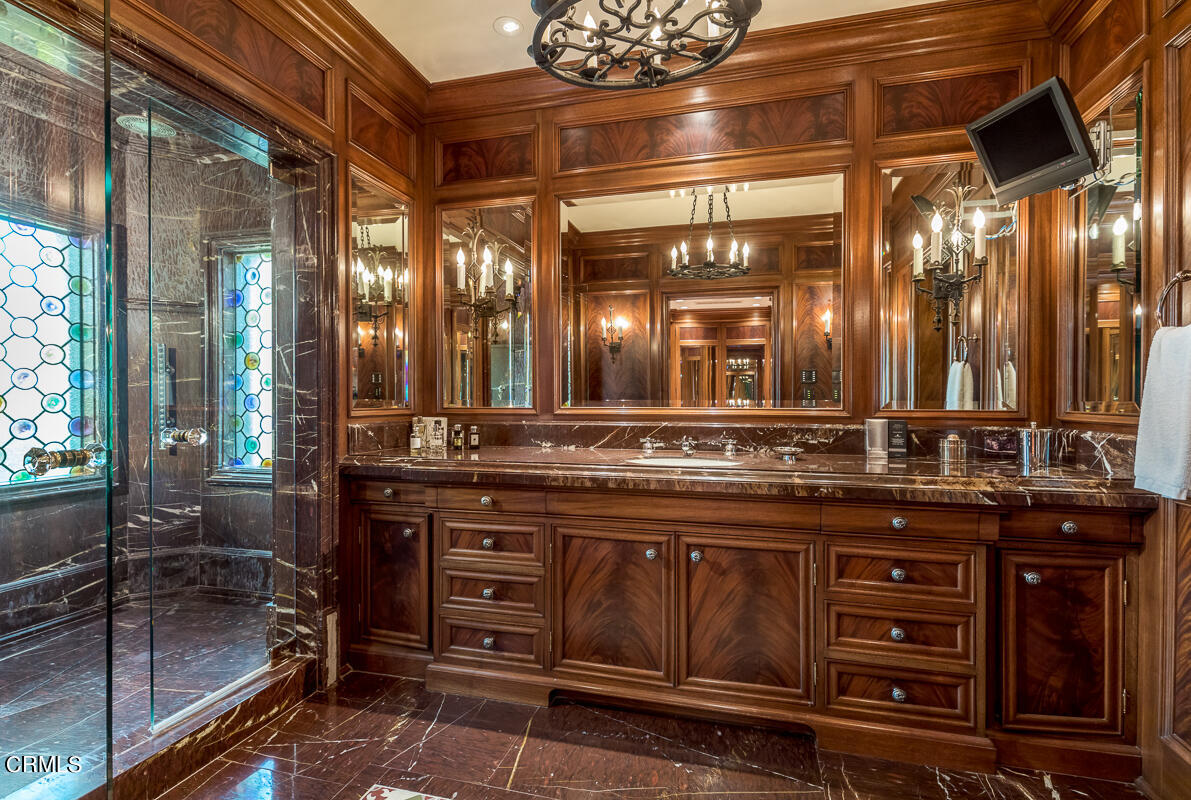 100 Los Altos Drive Pasadena, CA 91105 - Photo 41 of 72 a bathroom with a sink a vanity and a large mirror
