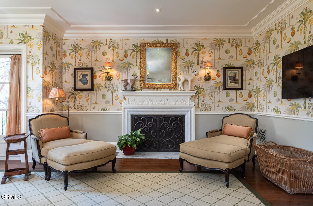 100 Los Altos Drive Pasadena, CA 91105 - Photo 44 of 72 a living room with furniture a flat screen tv and a fireplace