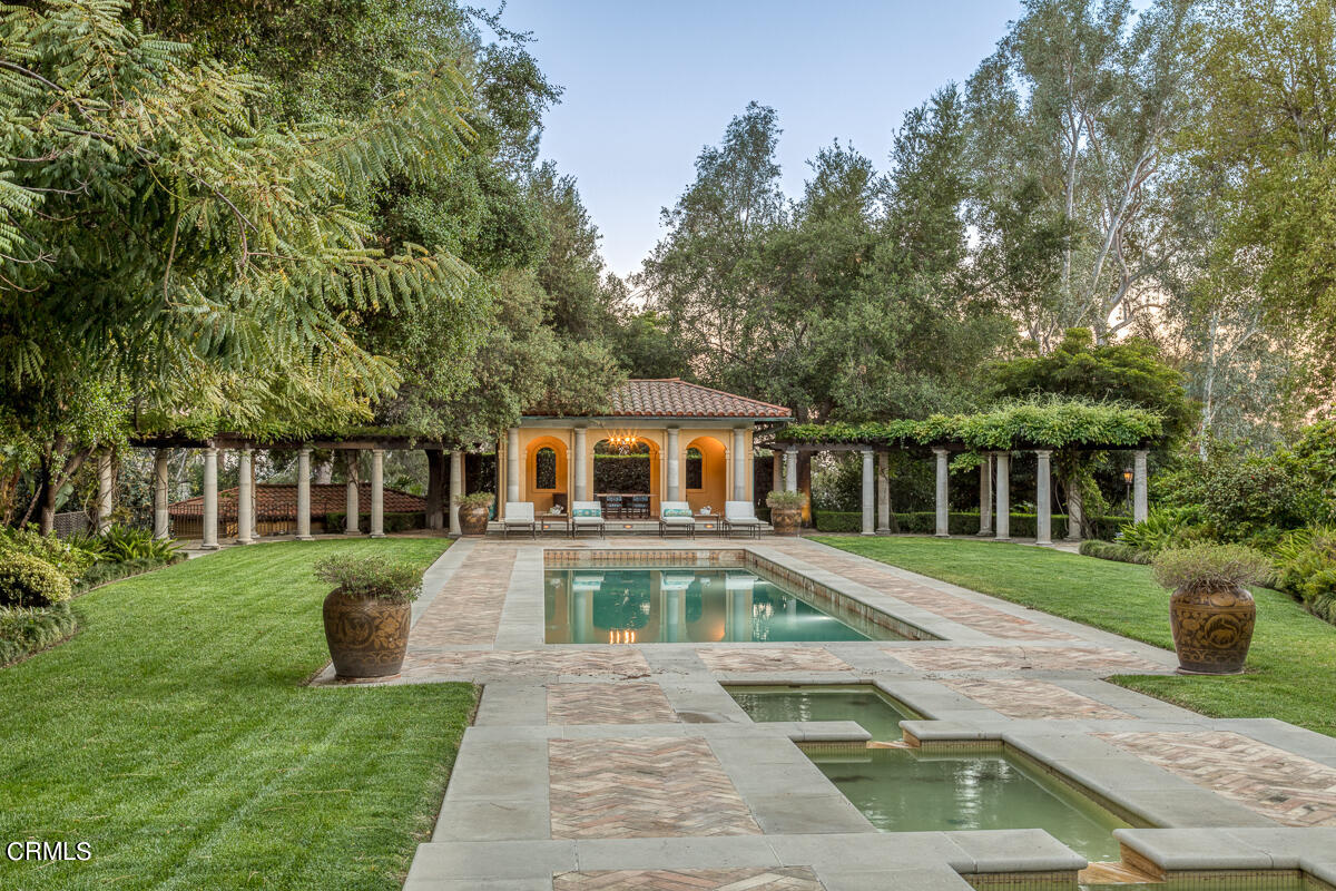 100 Los Altos Drive Pasadena, CA 91105 - Photo 59 of 72 a front view of a house with a yard table and chairs