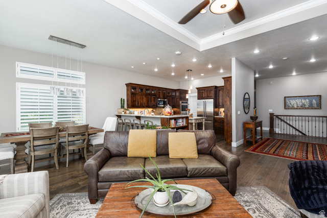 1132 Sunset Dunes Way Draper, UT 84020 - Photo 6 of 35 Expansive living area featuring wood-finish flooring, recessed lighting, and a tray ceiling with a ceiling fan
