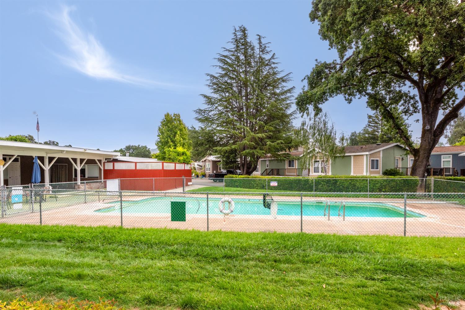 5754 Lois Avenue Santa Rosa, CA 95403 - Photo 22 of 23 a view of a big house with a big yard and palm trees