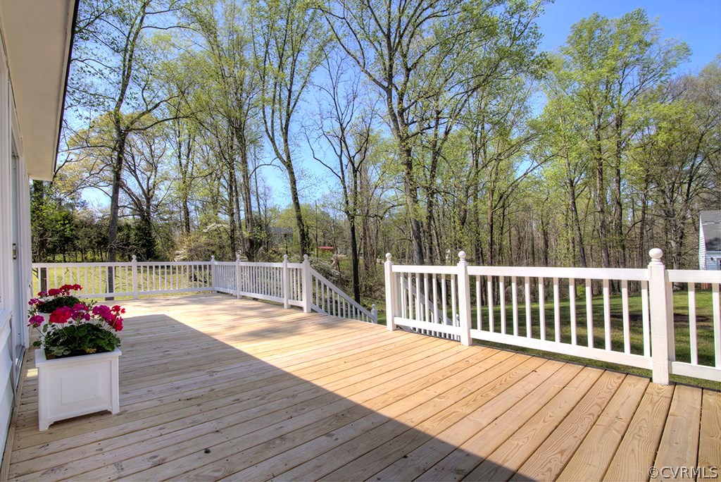 202 Lancaster Road King William, VA 23086 - Photo 11 of 31 Deck showing railing and steps to the back yard