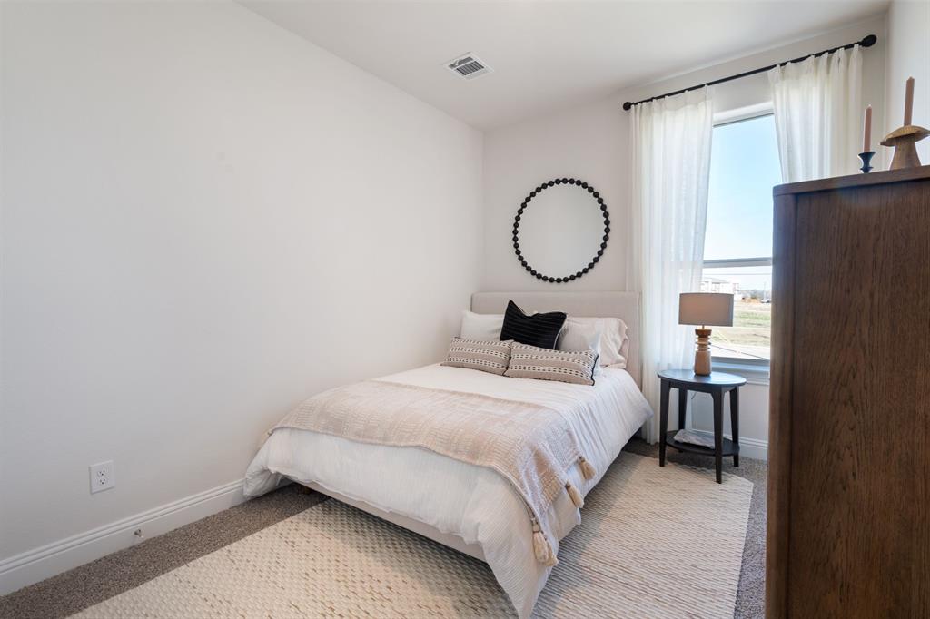 1008 Snapdragon Drive Euless, TX 76039 - Photo 11 of 12 a bedroom with a bed and a closet