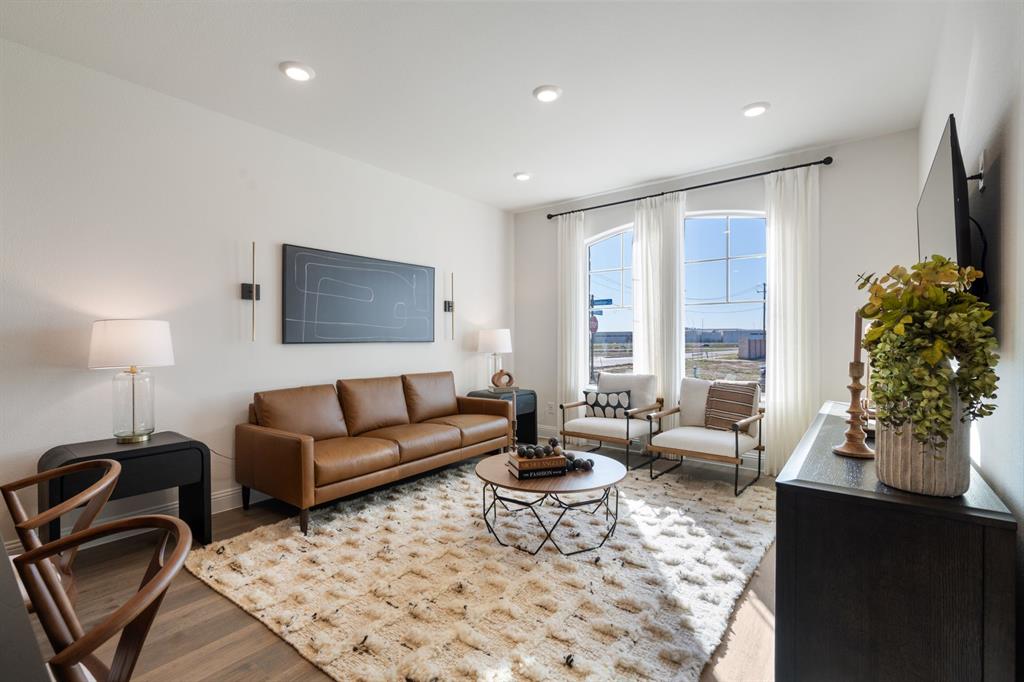 1008 Snapdragon Drive Euless, TX 76039 - Photo 2 of 12 a living room with furniture lamp and a flat screen tv