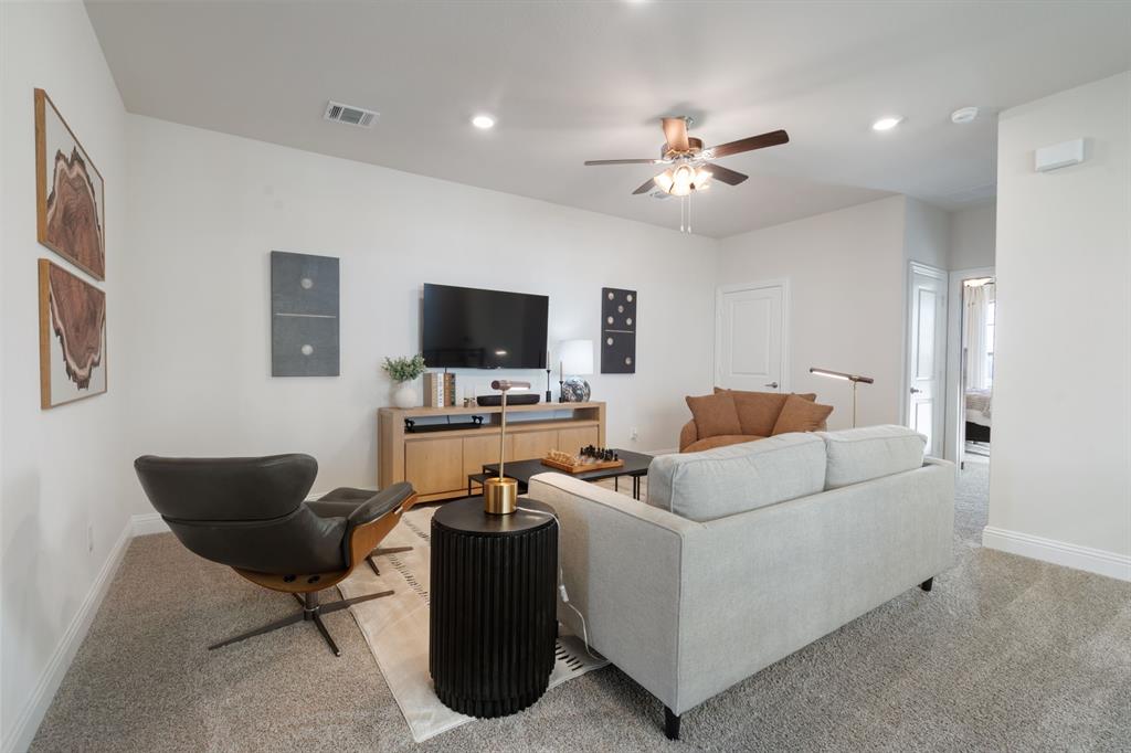 1008 Snapdragon Drive Euless, TX 76039 - Photo 5 of 12 a living room with furniture and a flat screen tv
