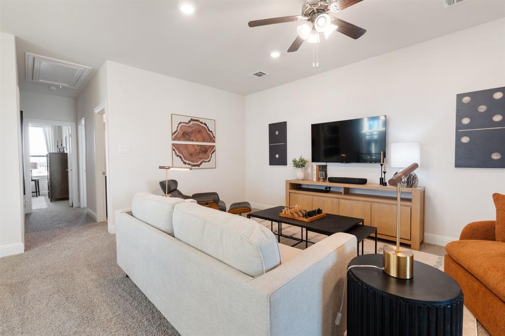 1008 Snapdragon Drive Euless, TX 76039 - Photo 6 of 12 a living room with furniture and a flat screen tv