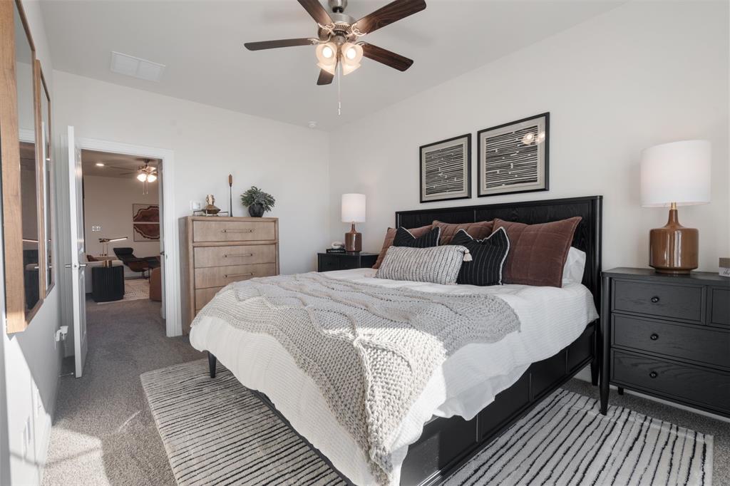 1008 Snapdragon Drive Euless, TX 76039 - Photo 7 of 12 a bedroom with a bed and ceiling fan
