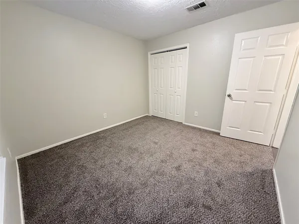 an empty room with closet
