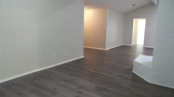 a view of a livingroom with wooden floor