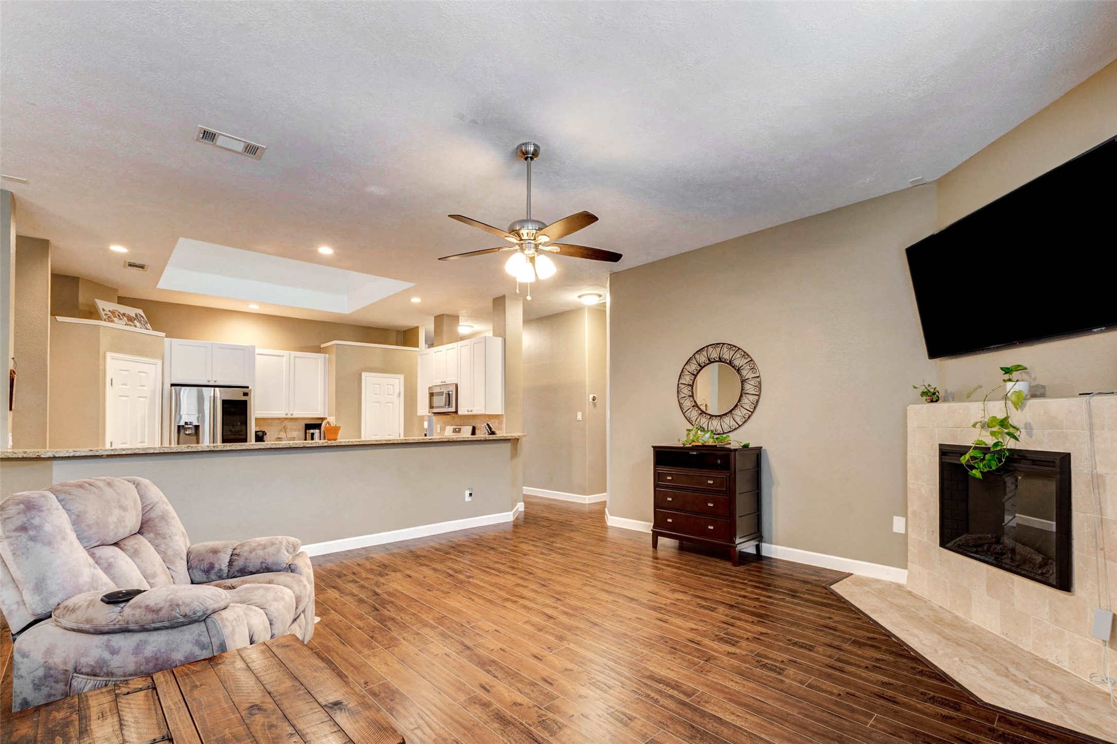 6334 Sampras Ace Court Spring, TX 77379 - Photo 12 of 48 Large family room that keeps the cook connected to all the fun. Cozy up to the fireplace.