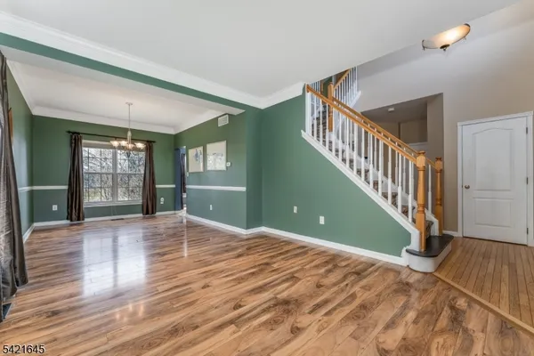 a view of a livingroom with wooden floor
