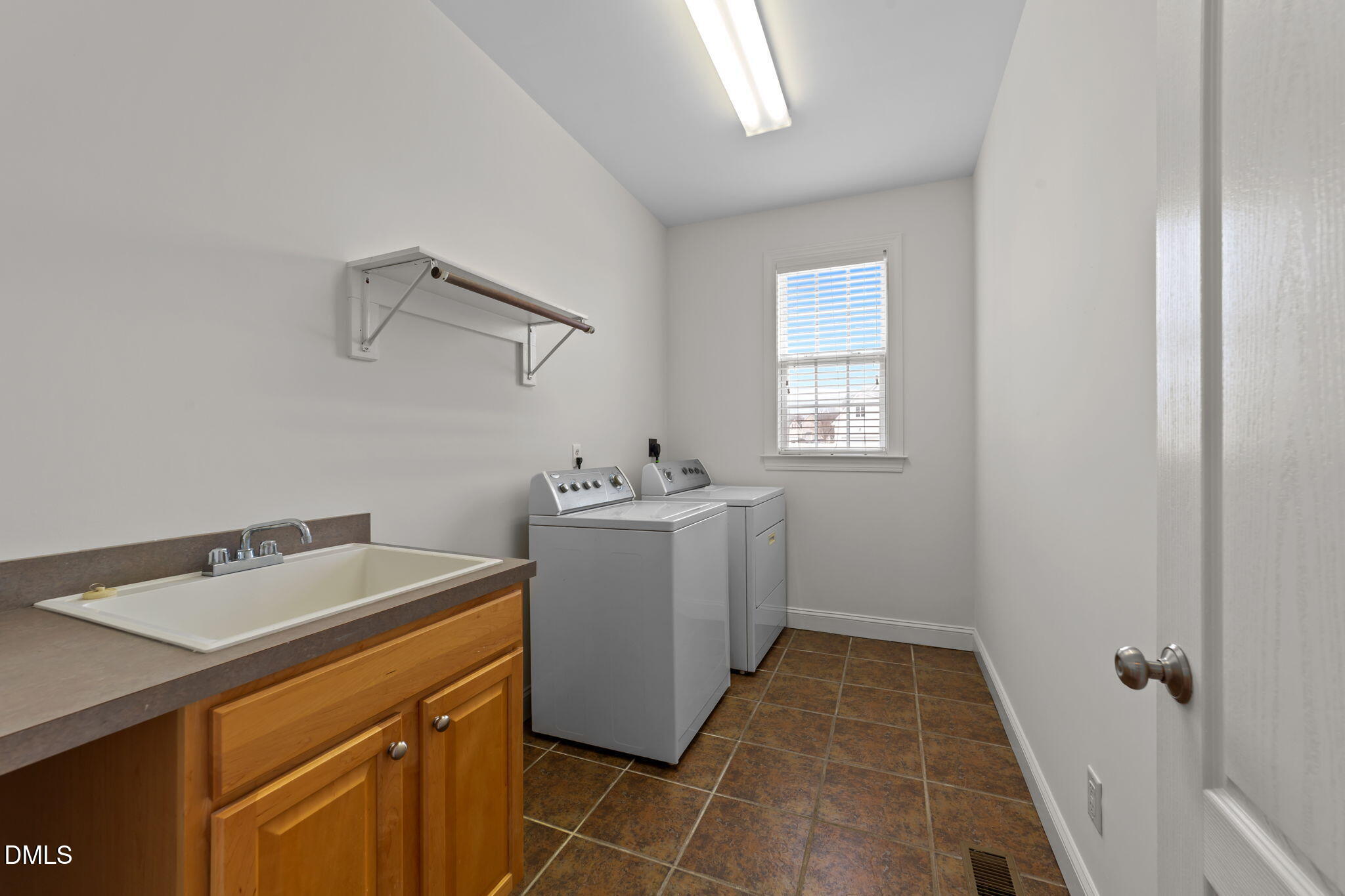 7101 Numa Circle Willow Spring, NC 27592 - Photo 13 of 44 a utility room with dryer and washer