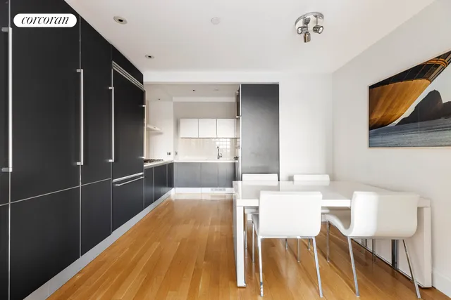 a view of a room that has a bed and a window