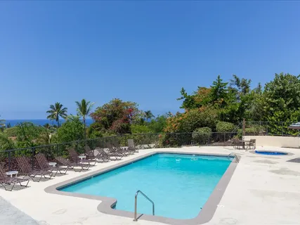 a view of a swimming pool with a yard