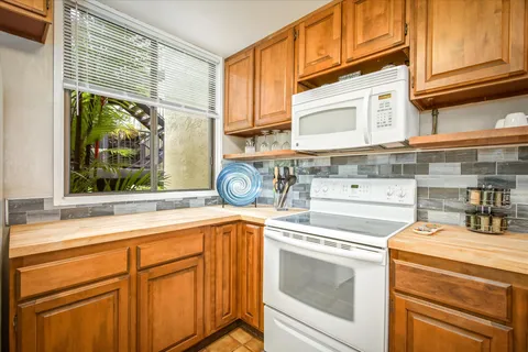 a kitchen with a stove and a sink