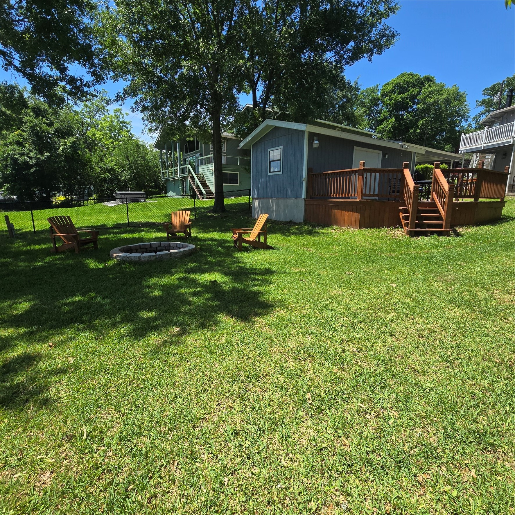 275 Sam Houston Loop Point Blank, TX 77364 - Photo 24 of 34 a view of a backyard with wooden fence and a bench