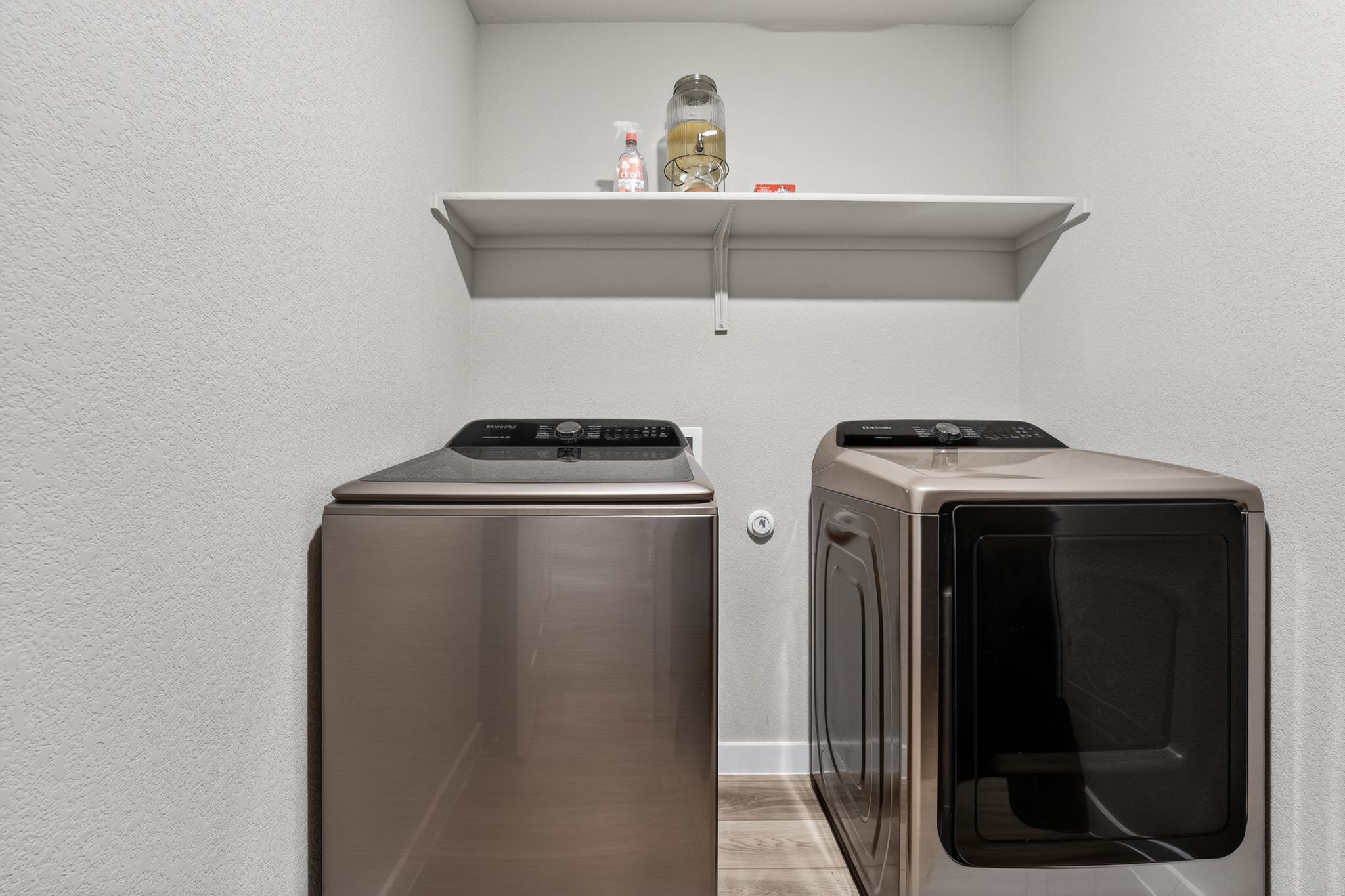 117 Halford Road Georgetown, TX 78633 - Photo 27 of 31 Laundry room with a textured wall, separate washer and dryer, and light wood-style floors