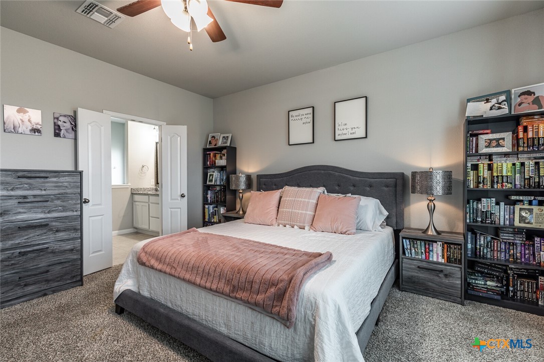 6142 Fairburn Temple, TX 76502 - Photo 18 of 38 a bedroom with a bed furniture and a book shelf