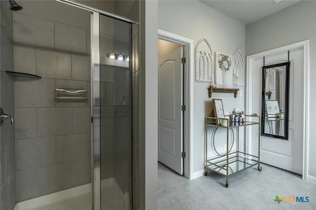 a bathroom with a bathtub and a shower