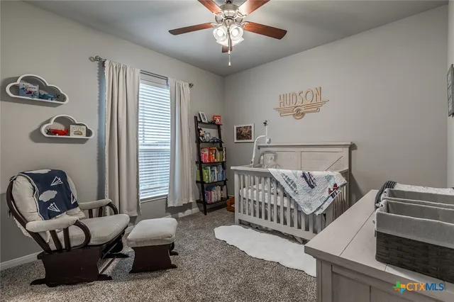 a room with furniture a air conditioner and a window