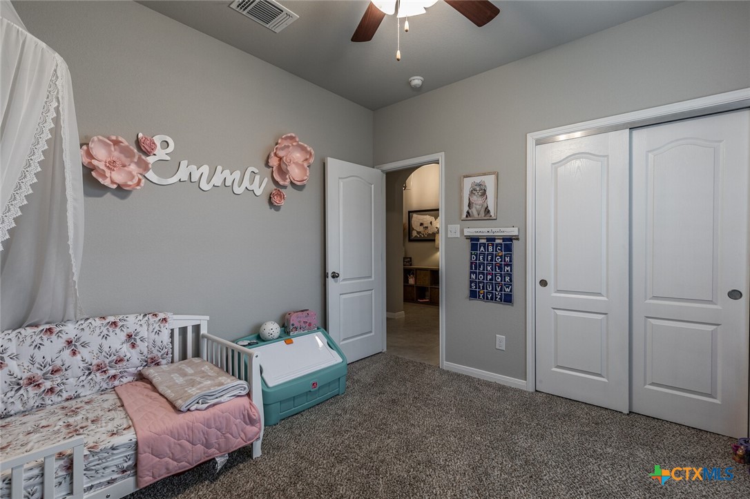6142 Fairburn Temple, TX 76502 - Photo 29 of 38 a living room with furniture and a chandelier