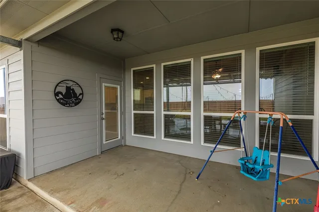 a view of swimming pool with outdoor seating