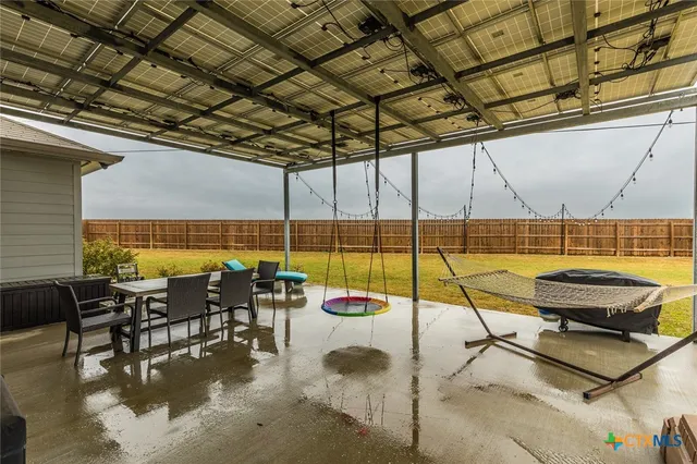 a view of a swimming pool with sitting area