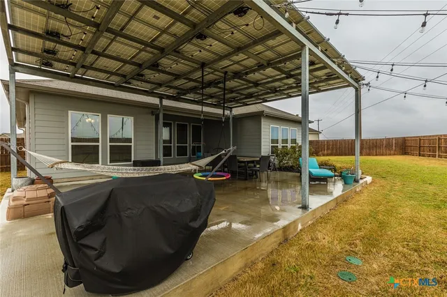a view of a swimming pool with outdoor seating